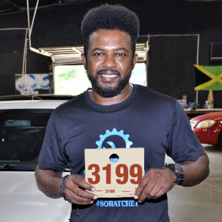 Dispatch Numbers Technician with Vehicle Identification Number at auto repair shop.